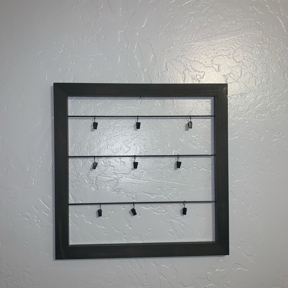 Black wooden frame w hooks to hang pictures!